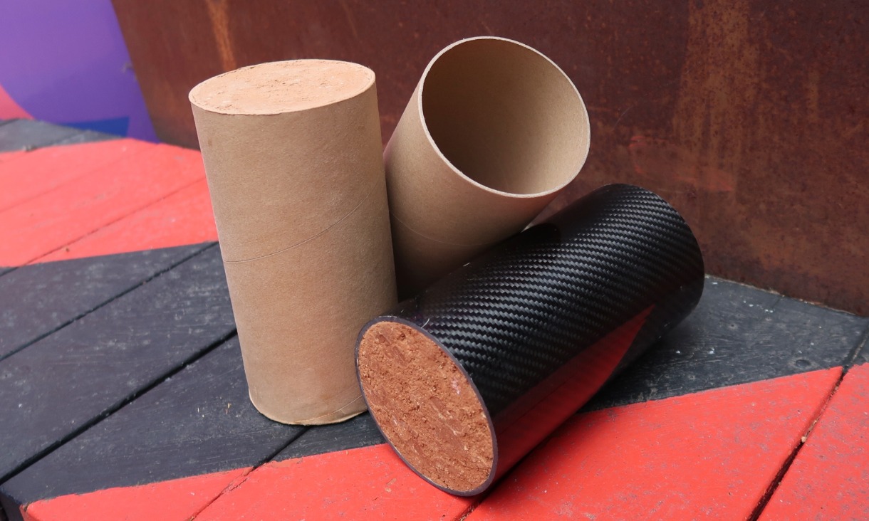 a cardboard-confined rammed earth column and CFRP-confined rammed earth column.