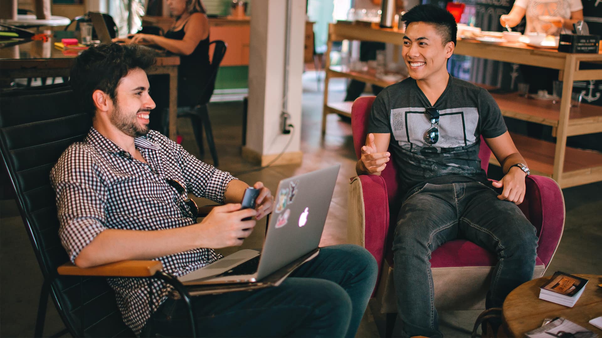 Students in a cafe on a laptop