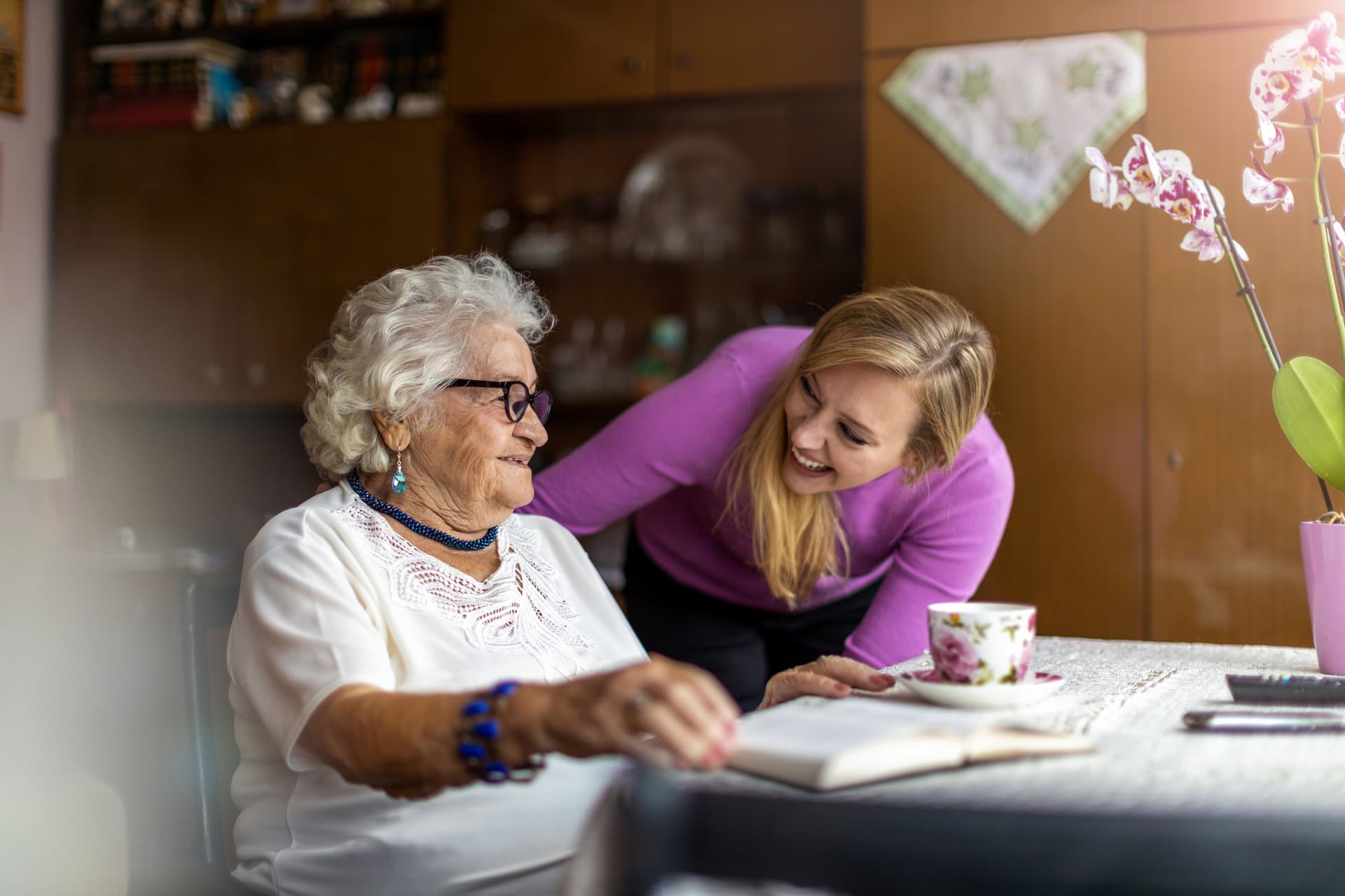 Person engaging with elderly person at home