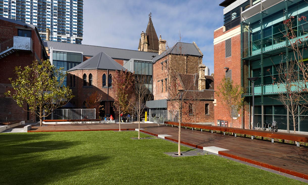 University lawn with buildings in the background