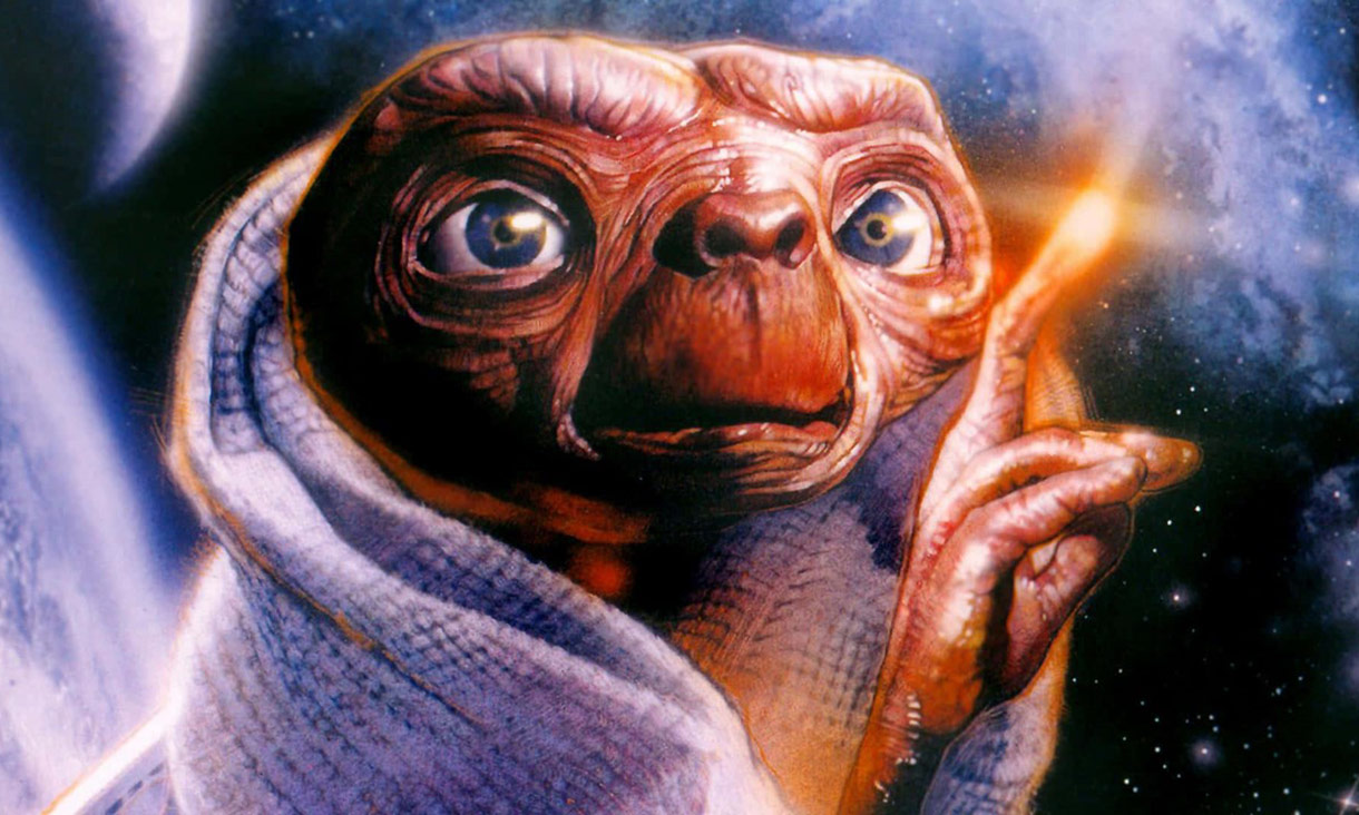 ET holding out his finger with light coming from it