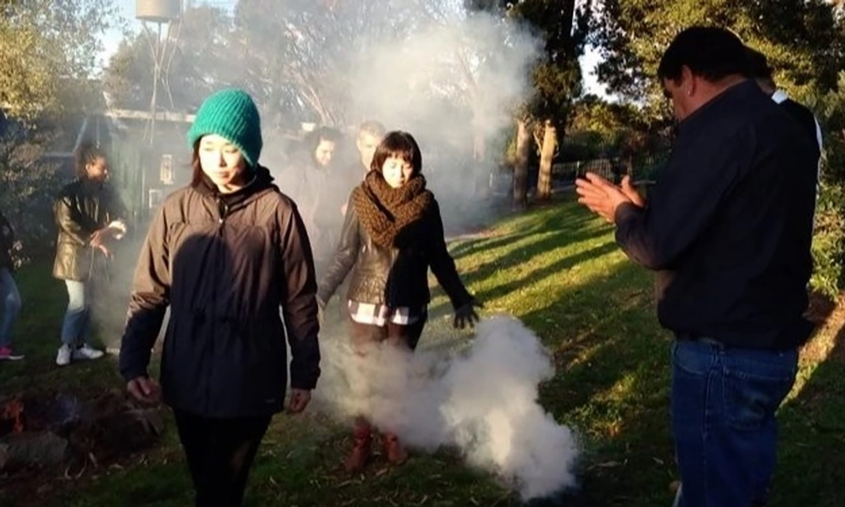 People at a smoking ceremony