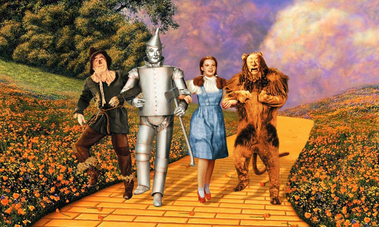 Dorothy, Scarecrow, Tinman and Lion walking on the yellow brick road