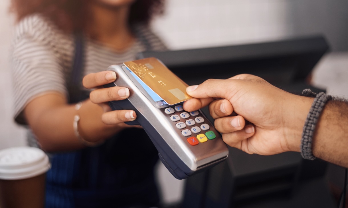 close up of card being tapped on a payment terminal