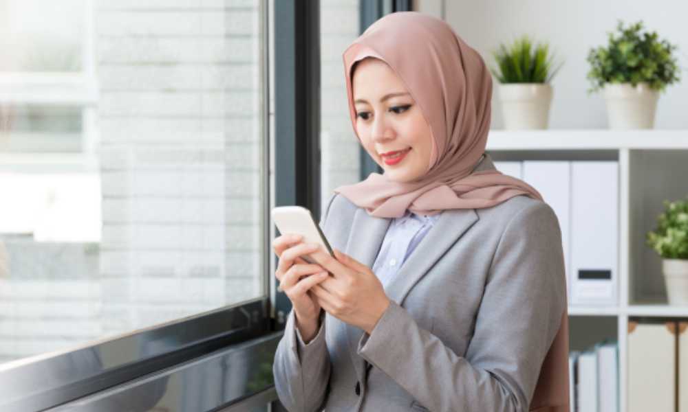 Person in business attire holding phone