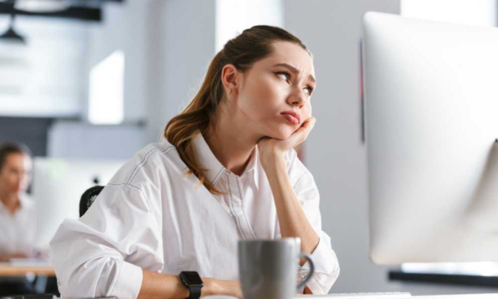 Office worker looking bored