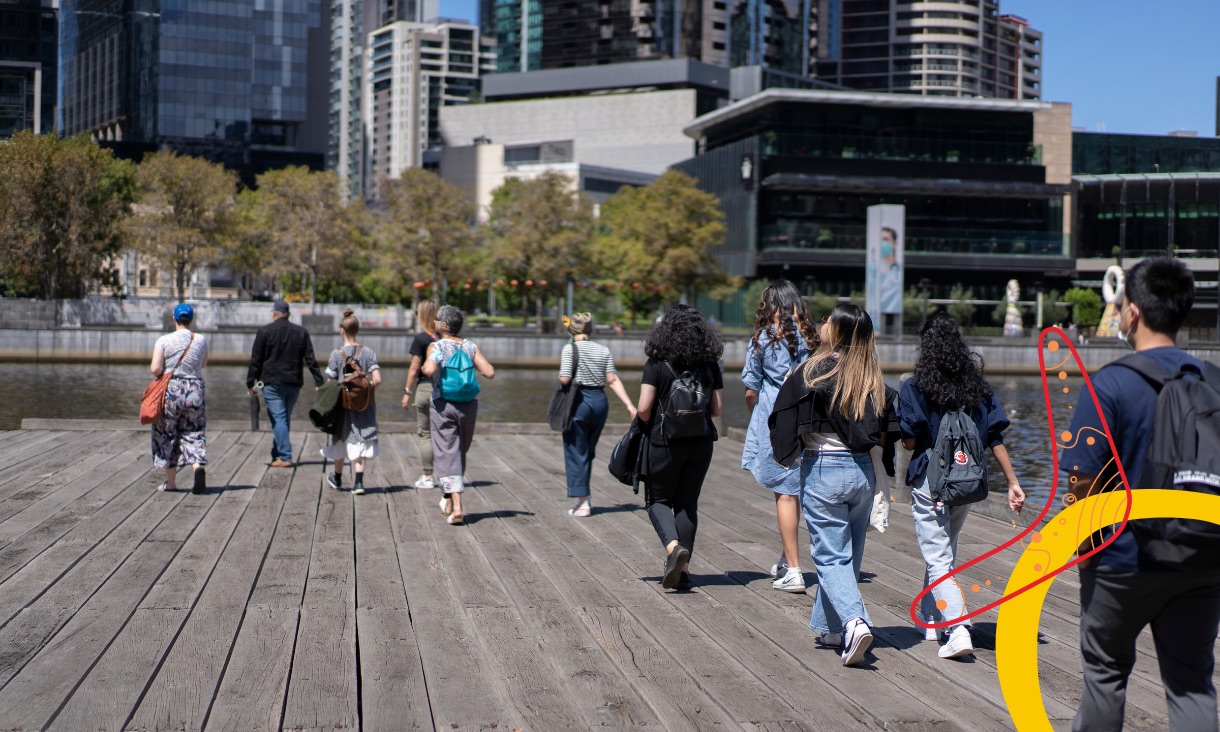 Students on a tour walk on a deck in South Yarra.