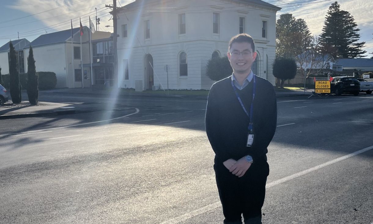 An image of Vincent standing on the street