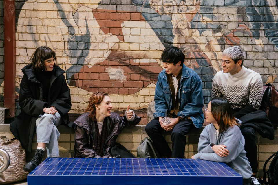 A group of students on campus chatting to each other