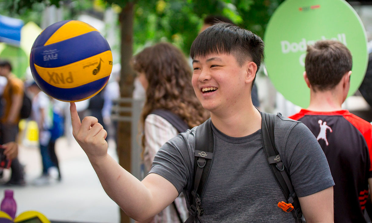 Man spinning basketball on his finger