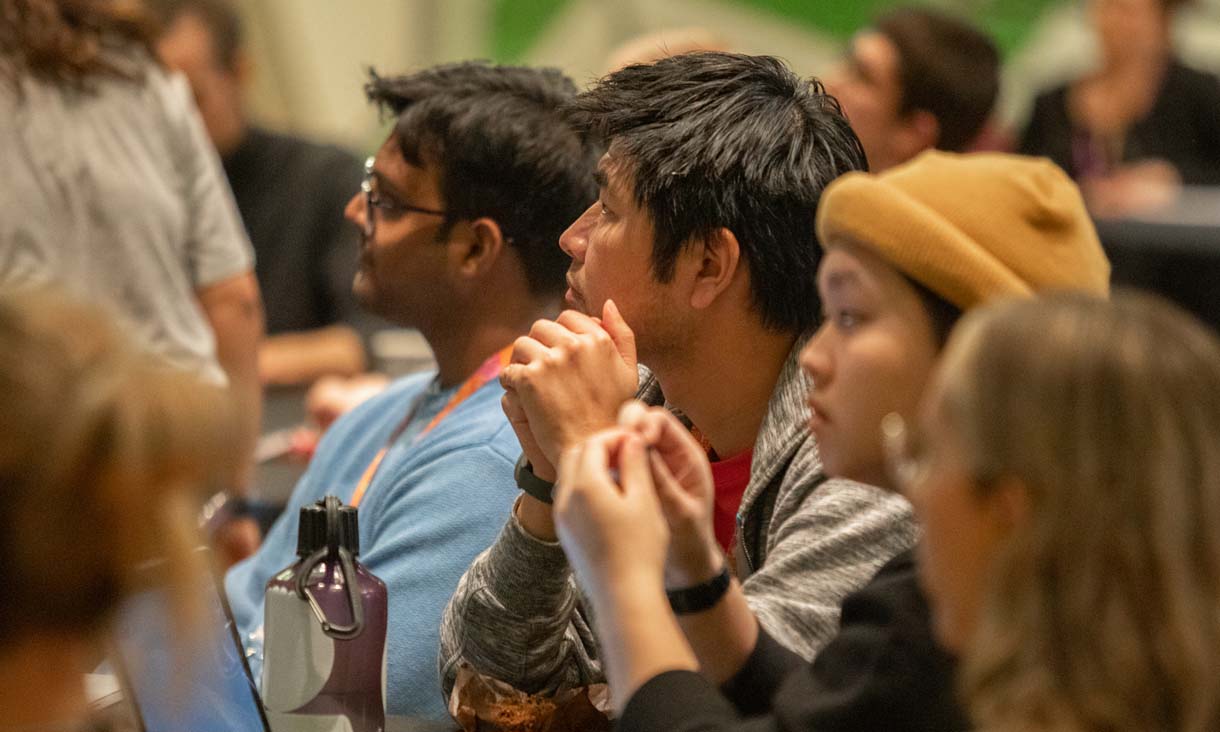 A group of students listening intently 