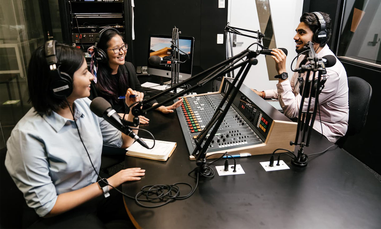 3 RMIT journalism students are on-air in radio studio.