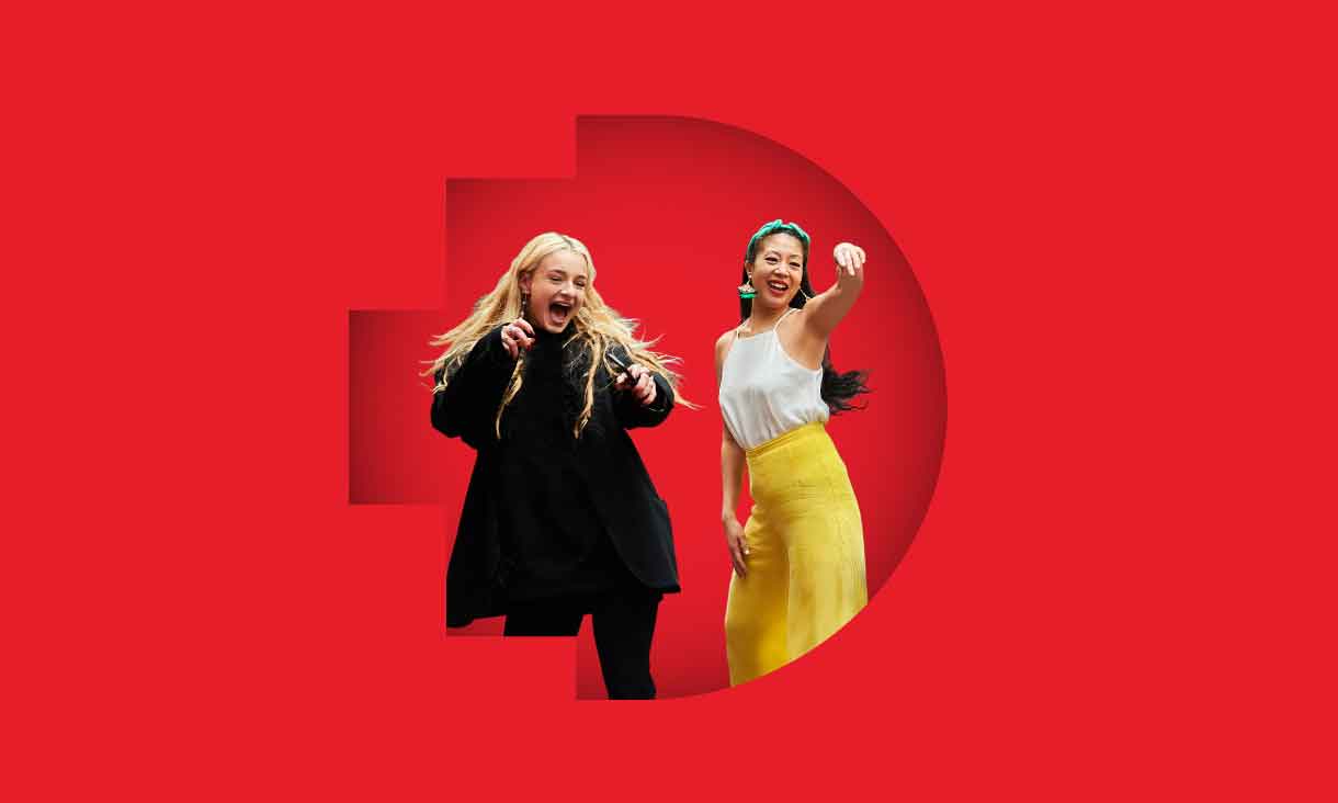 Two students raise their hands in excitement in front of a red background with the RMIT pixel logo.