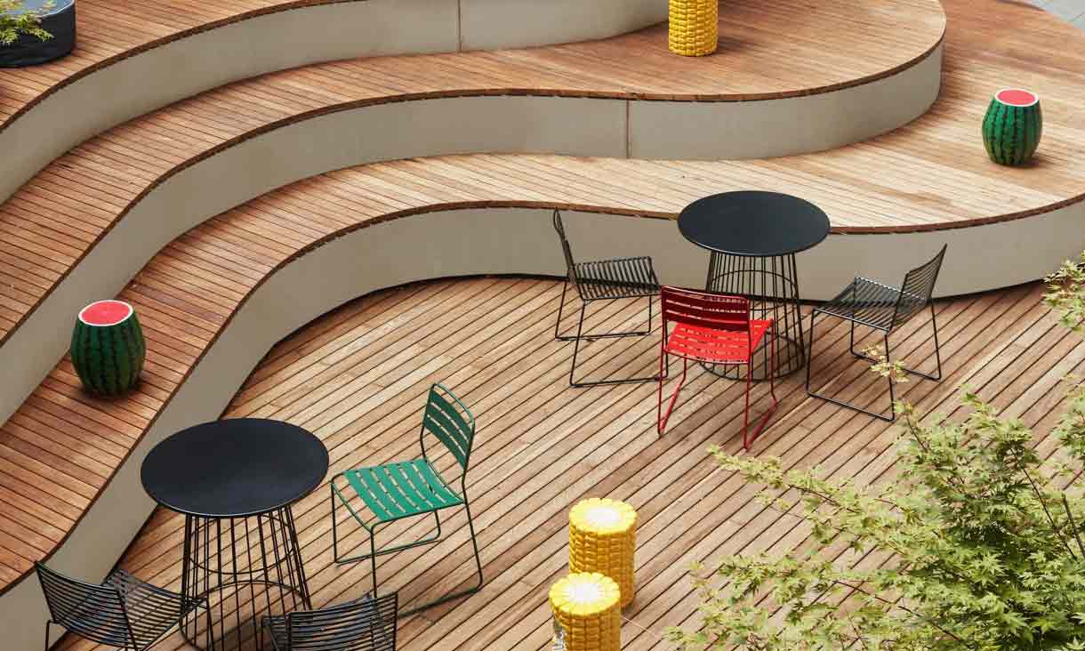 Outdoor wooden decking with chairs and tables