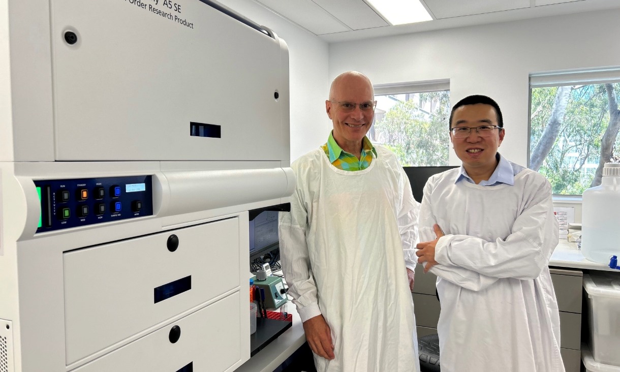 Professor Stephen Kent (left) with Dr Yi (David) Ju next to the flow cytometer in a Doherty Institute lab where they analysed blood samples. Credit: Thakshila Amarasena, Doherty Institute