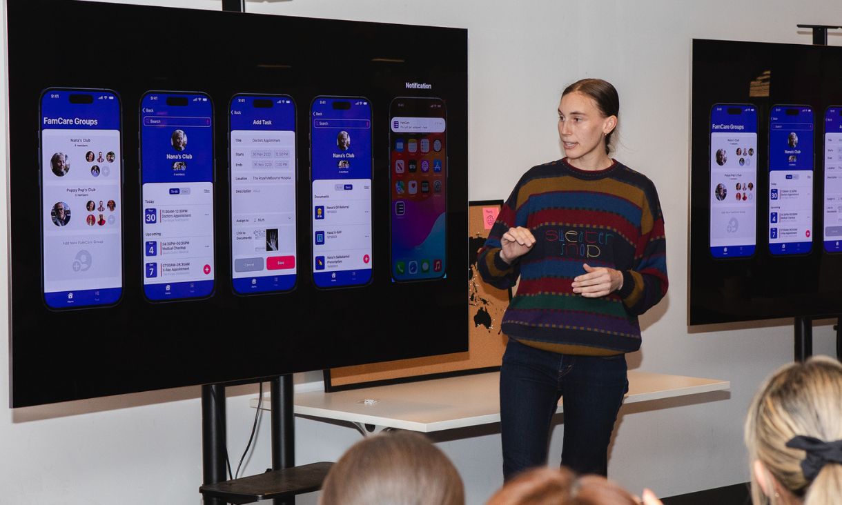 Woman presenting app idea to group