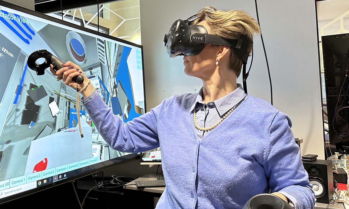 Associate Professor Gail Iles from RMIT University engaging in the virtual reality setting of the International Space Station in the Virtual Experiences Laboratory (VXLab) at RMIT. Credit: Seamus Daniel, RMIT University