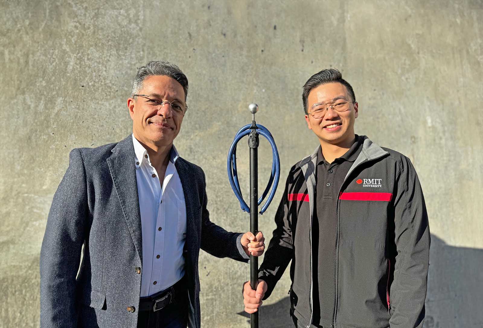 Professor Majid Nazem and Junlin Rong with the device. Credit: Michael Quin, RMIT.