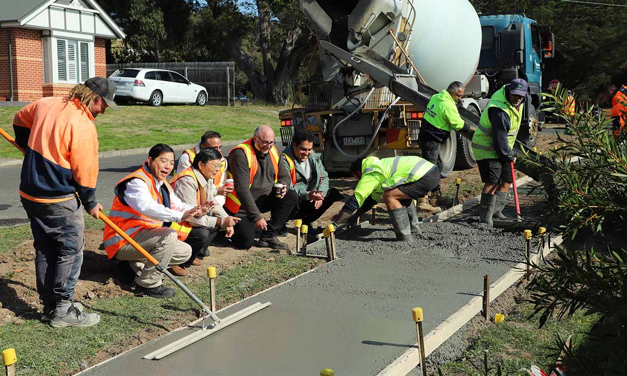 The pour of the coffee and wood-chip biochar concrete for the footpath trial in Gisborne took place earlier this month. Credit: Bodey Dittloff, Macedon Ranges Shire Council 