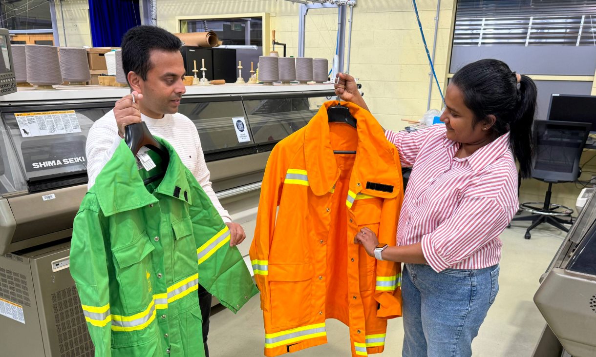 Dr Chamila Gunasekara (left) and PhD scholar Nayanatara Ruppegoda Gamage with discarded firefighting clothes that could be used to make crack-resistant, stronger concrete. Credit: Will Wright, RMIT University