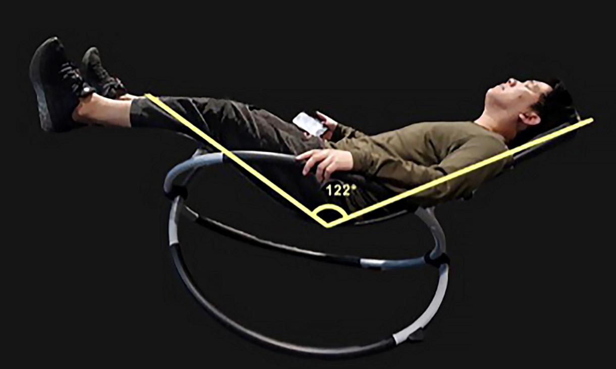 A person sitting in the microgravity posture. Credit: RMIT University