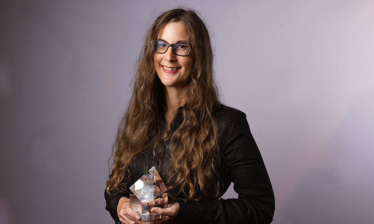 Louise Byrne holding award