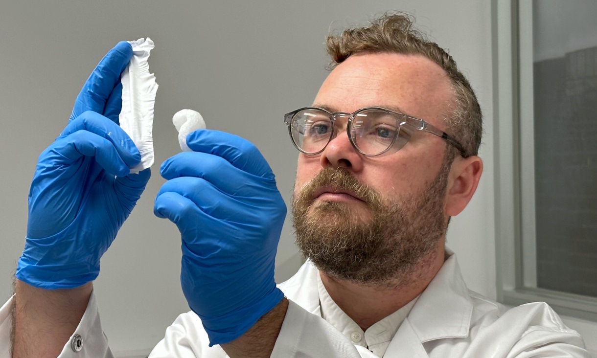 Dr Peter Sherrell with the invention (left) and polystyrene packing material that it is made from. Credit: Seamus Daniel, RMIT