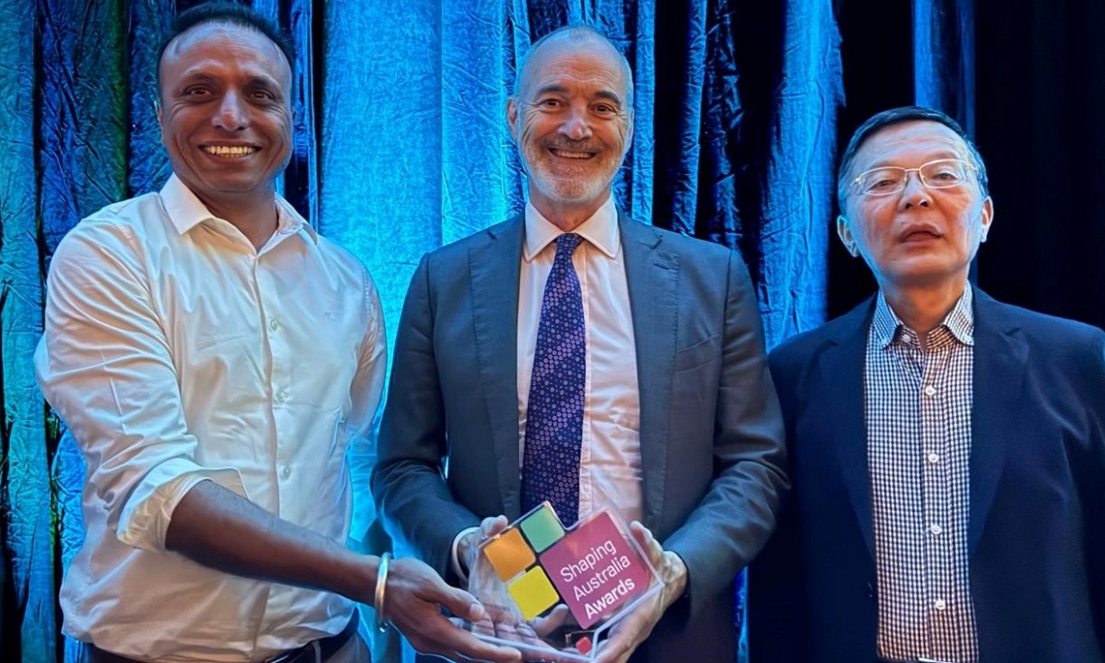 Coffee concrete innovators Dr Rajeev Roychand (left) and Professor Jie Li (right) celebrate their national research award with RMIT Vice-Chancellor Professor Alec Cameron at Parliament House in Canberra. Credit: supplied