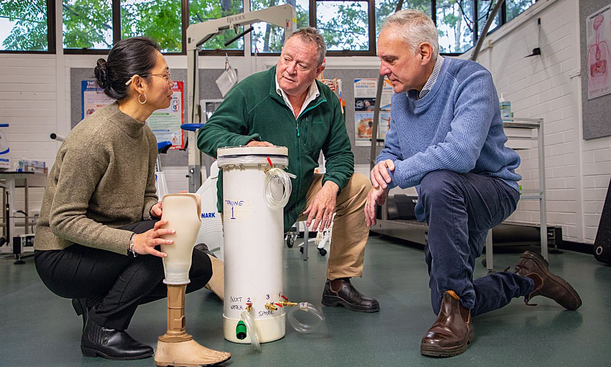 Dr Dawn Wong Lit Wan, Associate Professor Noel Lythgo and Dr Dein Vindigni (left to right) from RMIT's Digital Health Hub Rehabilitation Project with the PCAST system. Credit: Ant Bragaglia, RMIT University