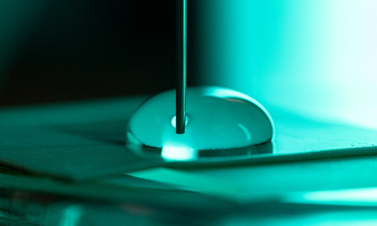 Photo of the electrical charge and contact areas created by water droplets spreading and contracting on a flat plate of Teflon - effectively simulating the movement of droplets over the surface..