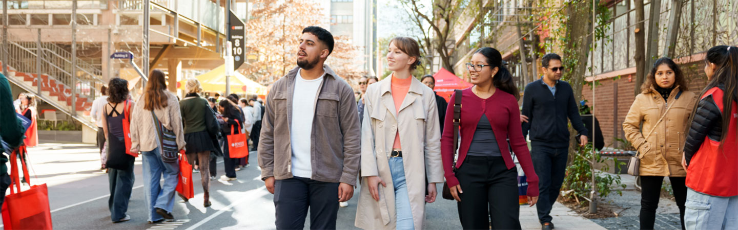 group of students walking among crowd at Bowen Street